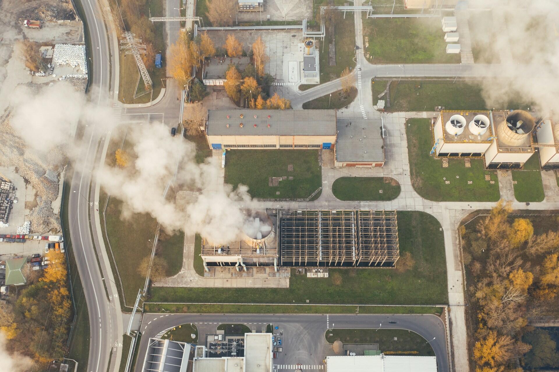 A bird's eye view of a production plant on a sunny day.