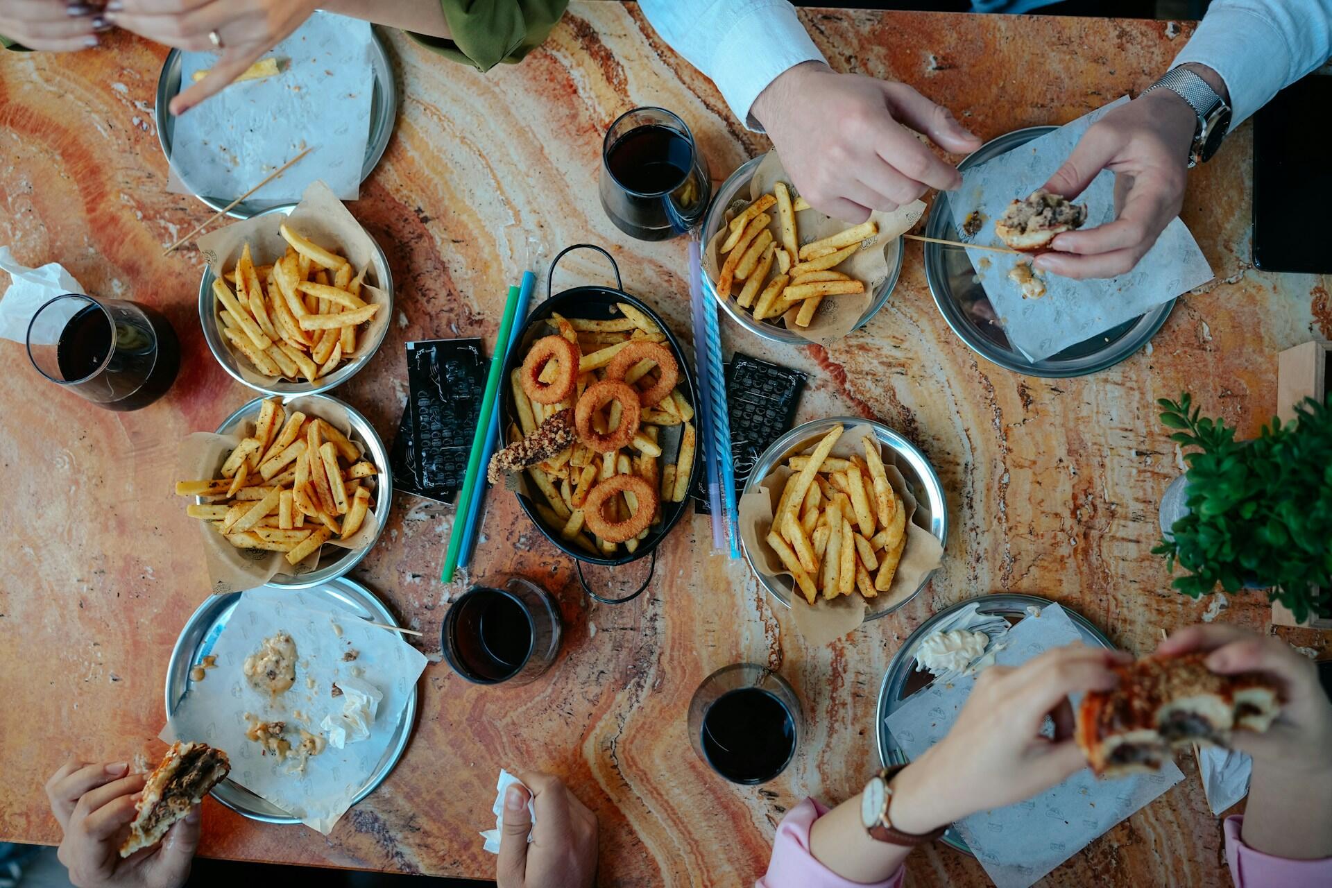 People eating fried food.
