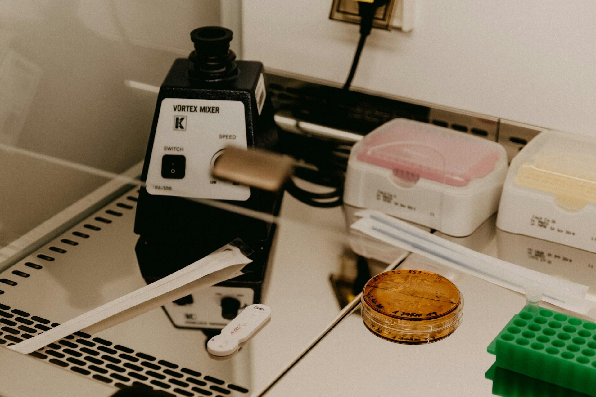 A tin of food next to science equipment.