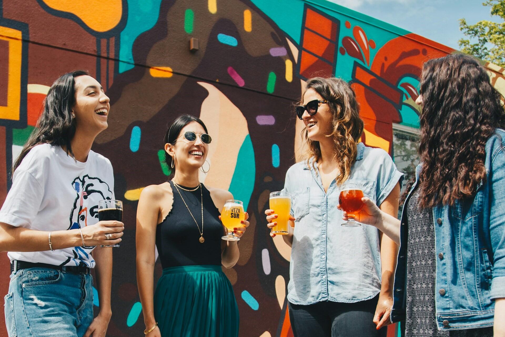 People socialising together with drinks.