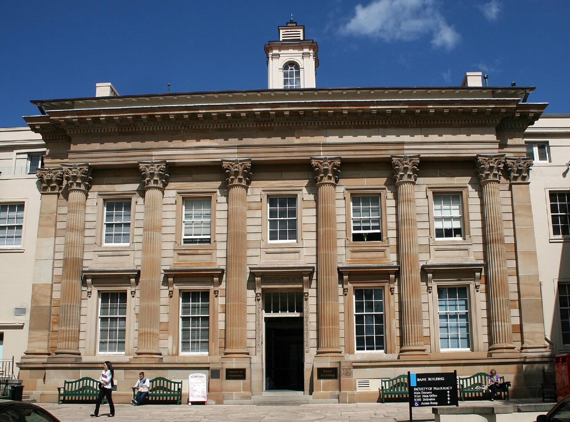 A large stone building on a sunny day.