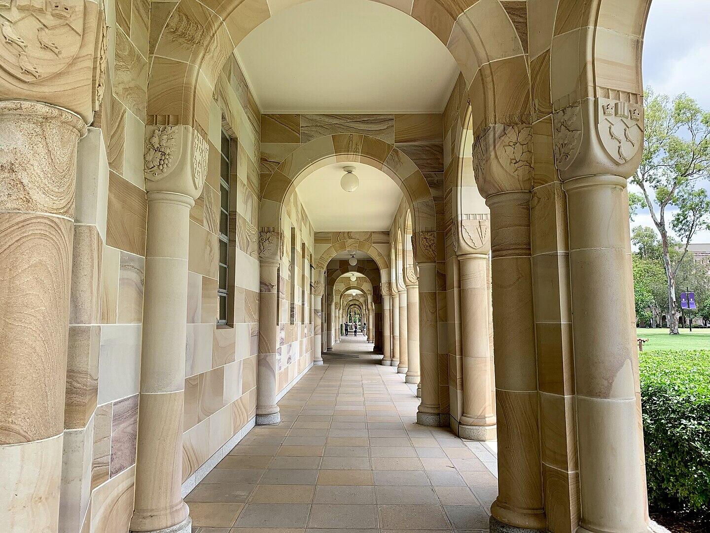 A stone archway passage with walkway.