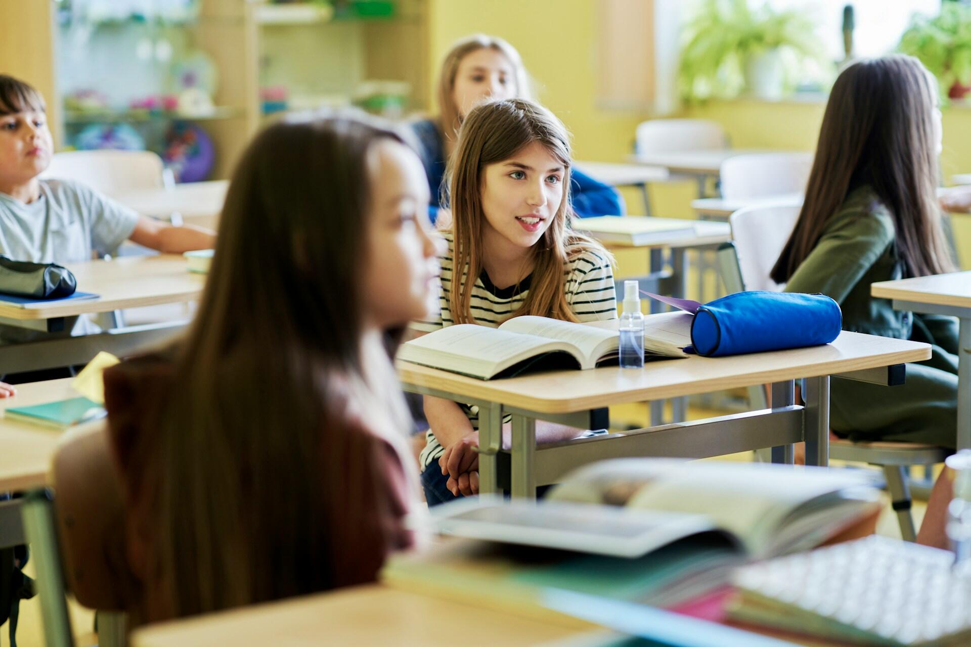 Students at their desks in a classroom.