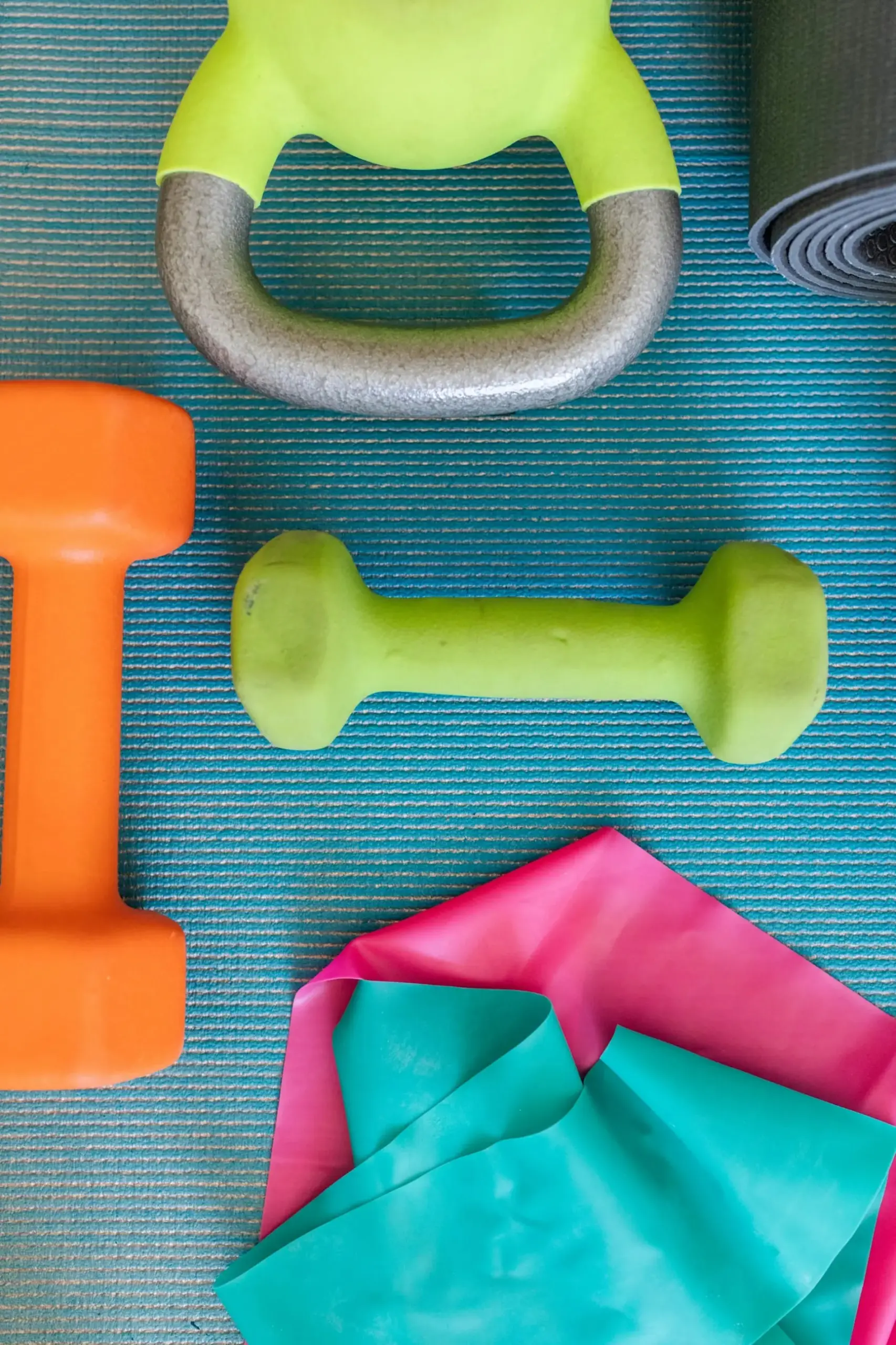 An exercise mat with various weights and exercise bands