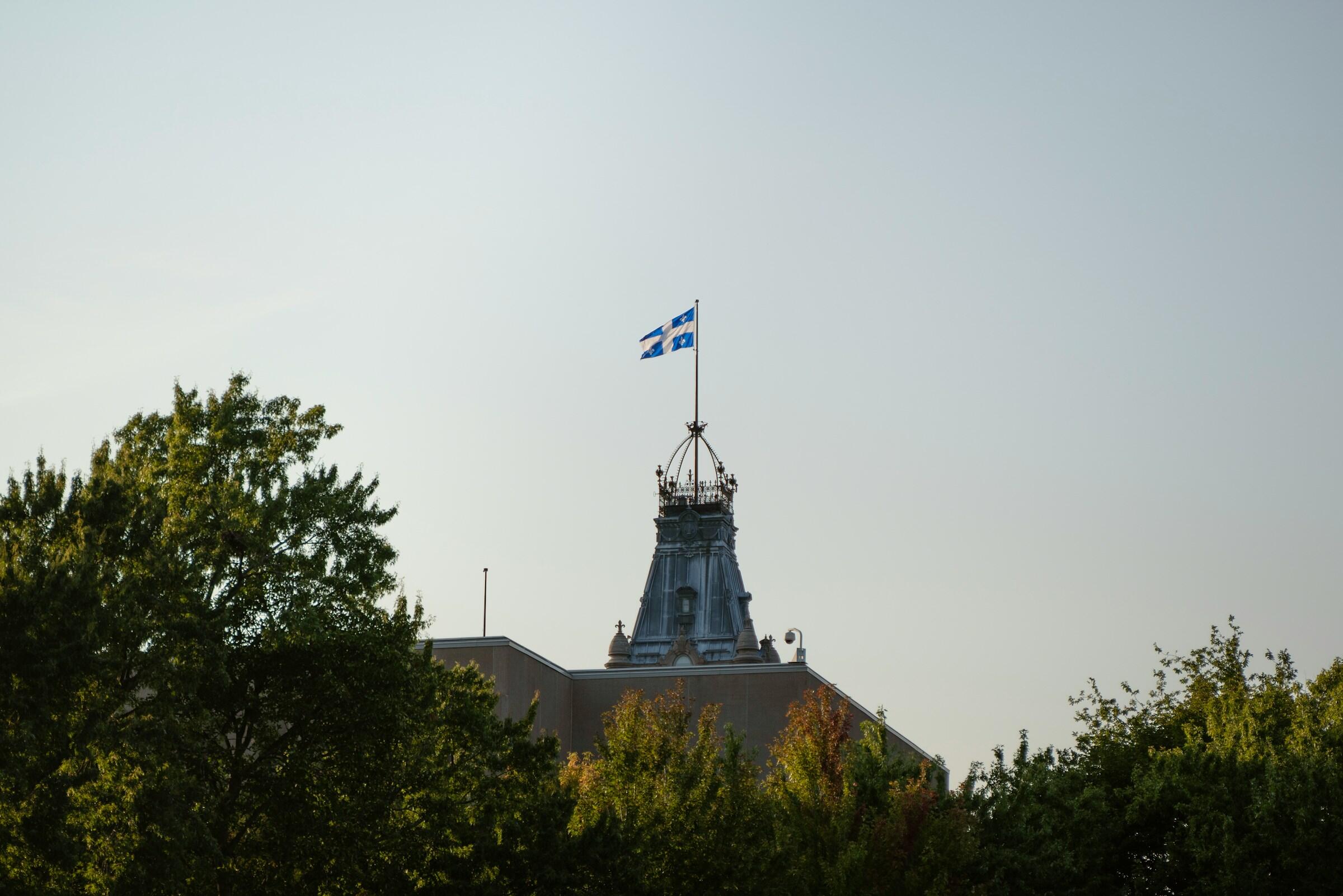 The top of a building features a decorative roof with a flag.