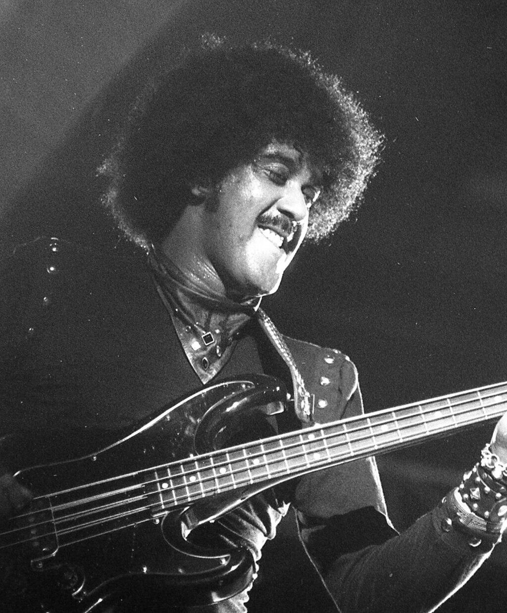 Irish musician Phil Lynott performing on stage.