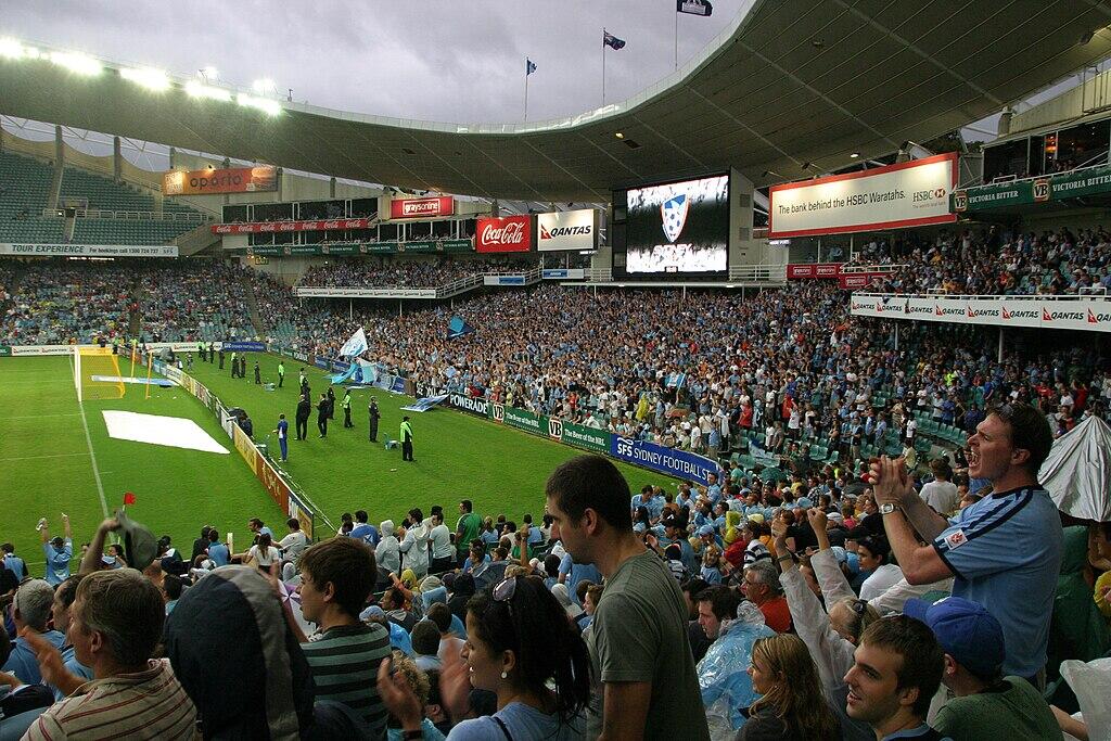A packed Sydney FC home stadium filled with cheering fans.