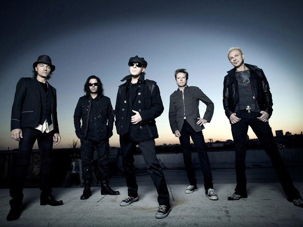 A band, the Scorpions, posing for a photo