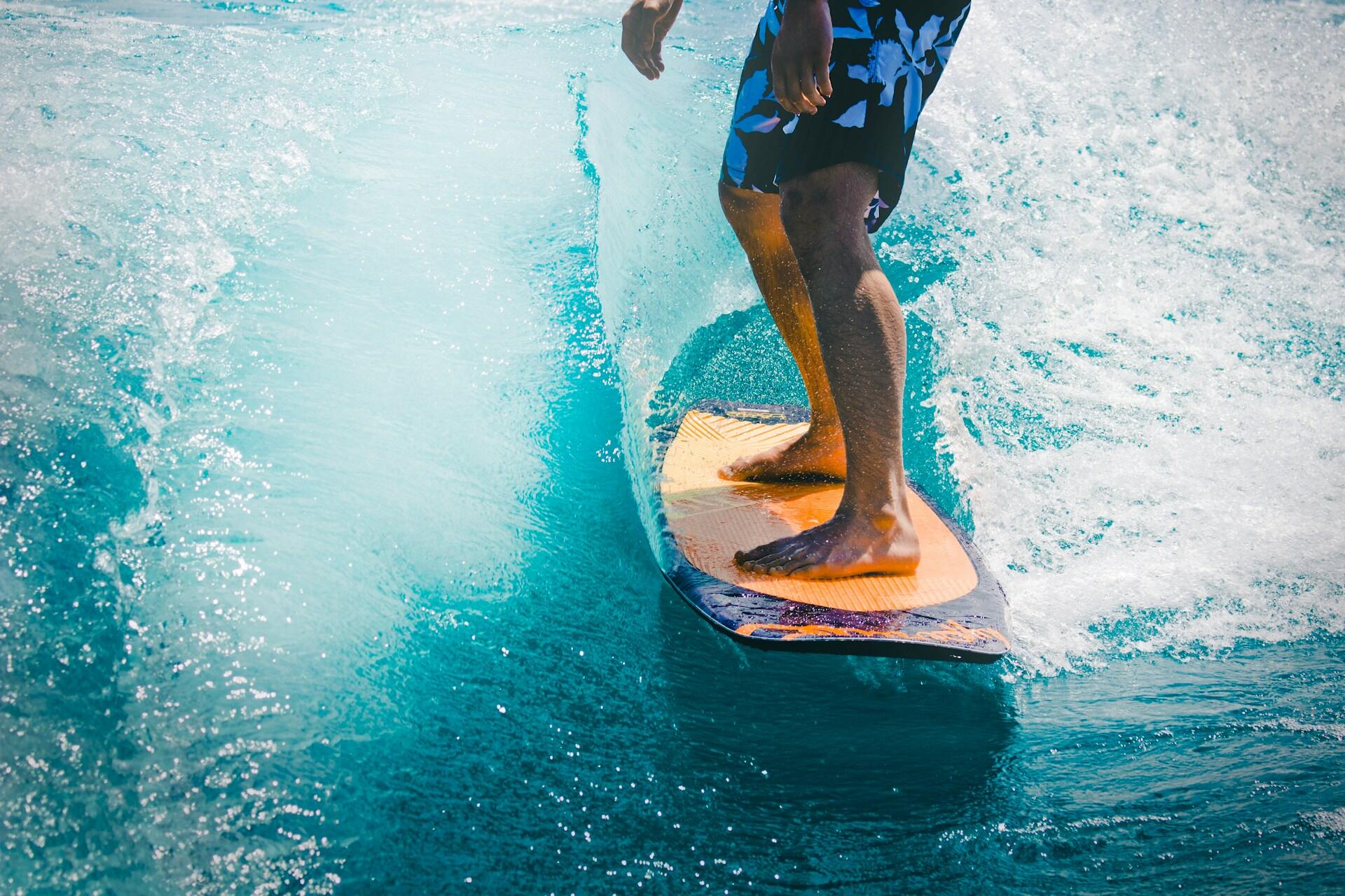 A novice surfer riding a wave.