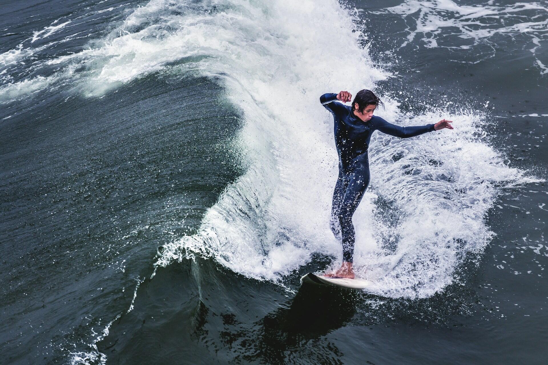 A surfer balancing on their board.