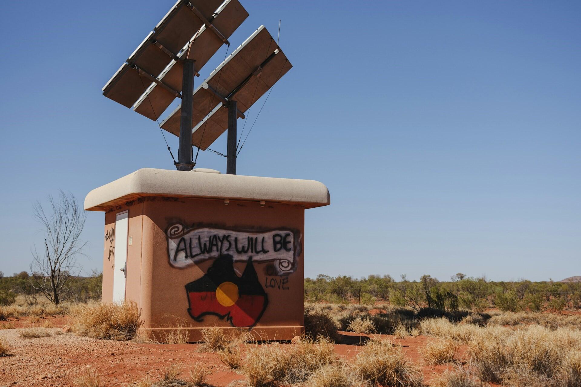 Graffiti using Aboriginal flag design.