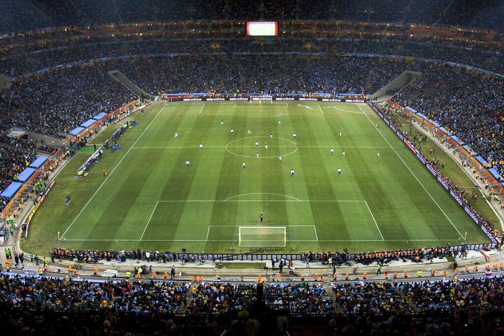 A packed stadium during a night football match.