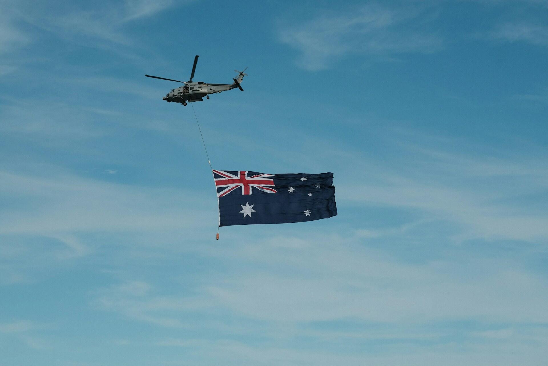 A helicopter flying the Australian flag.