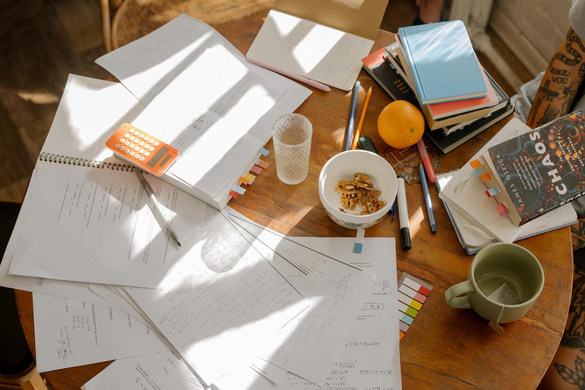 a table with homework and study materials strewn about