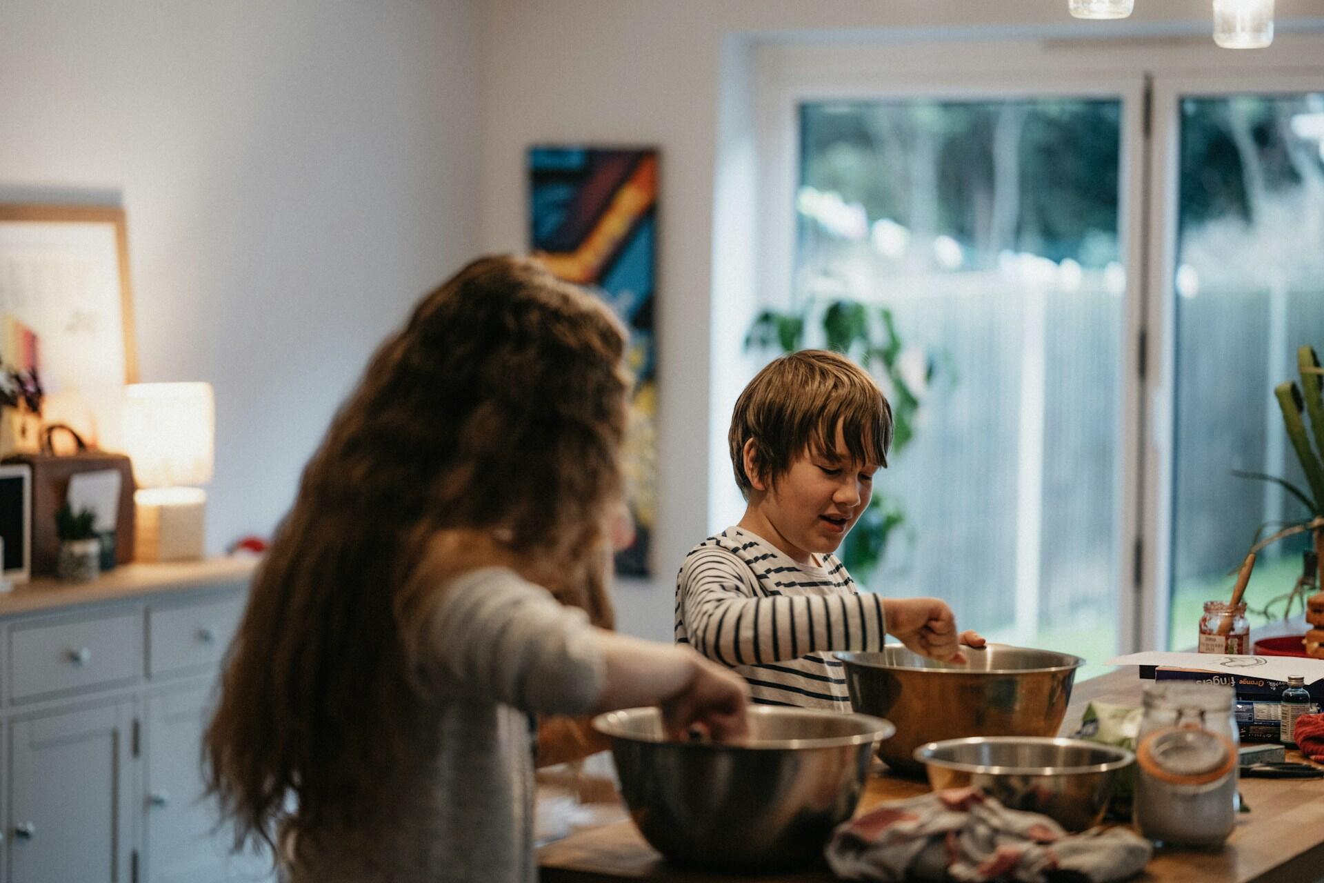 two young children baking