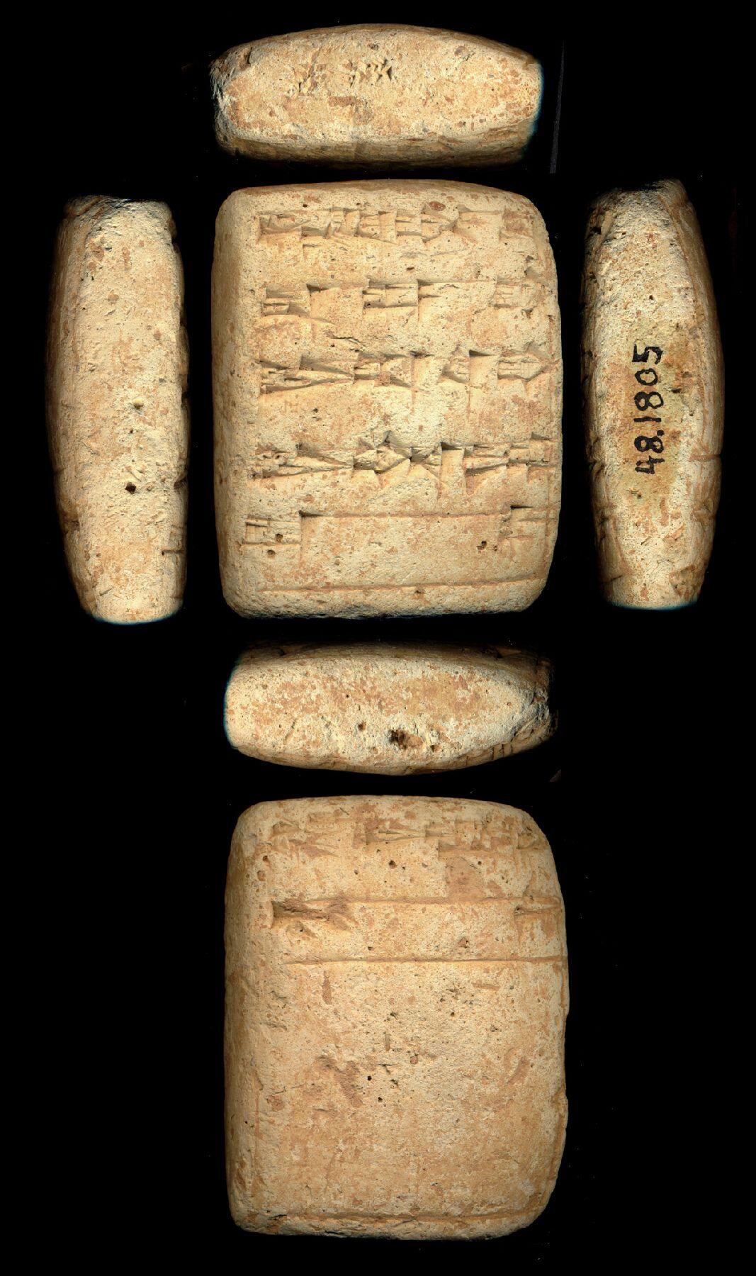 a museum photo of all sides of a clay tablet wedge with cuneiform inscriptions on multiple sides