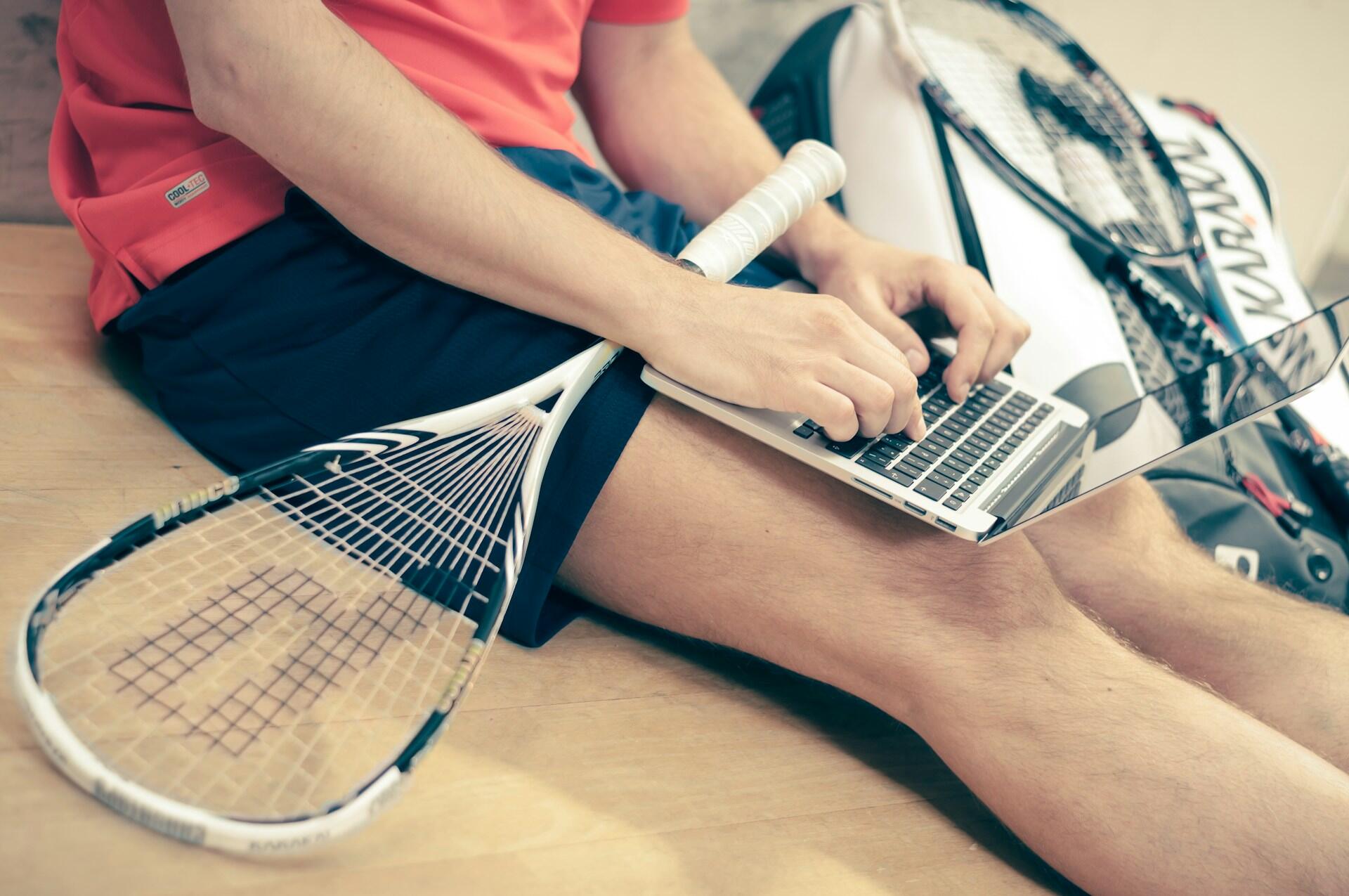 teen doing homework at tennis practice