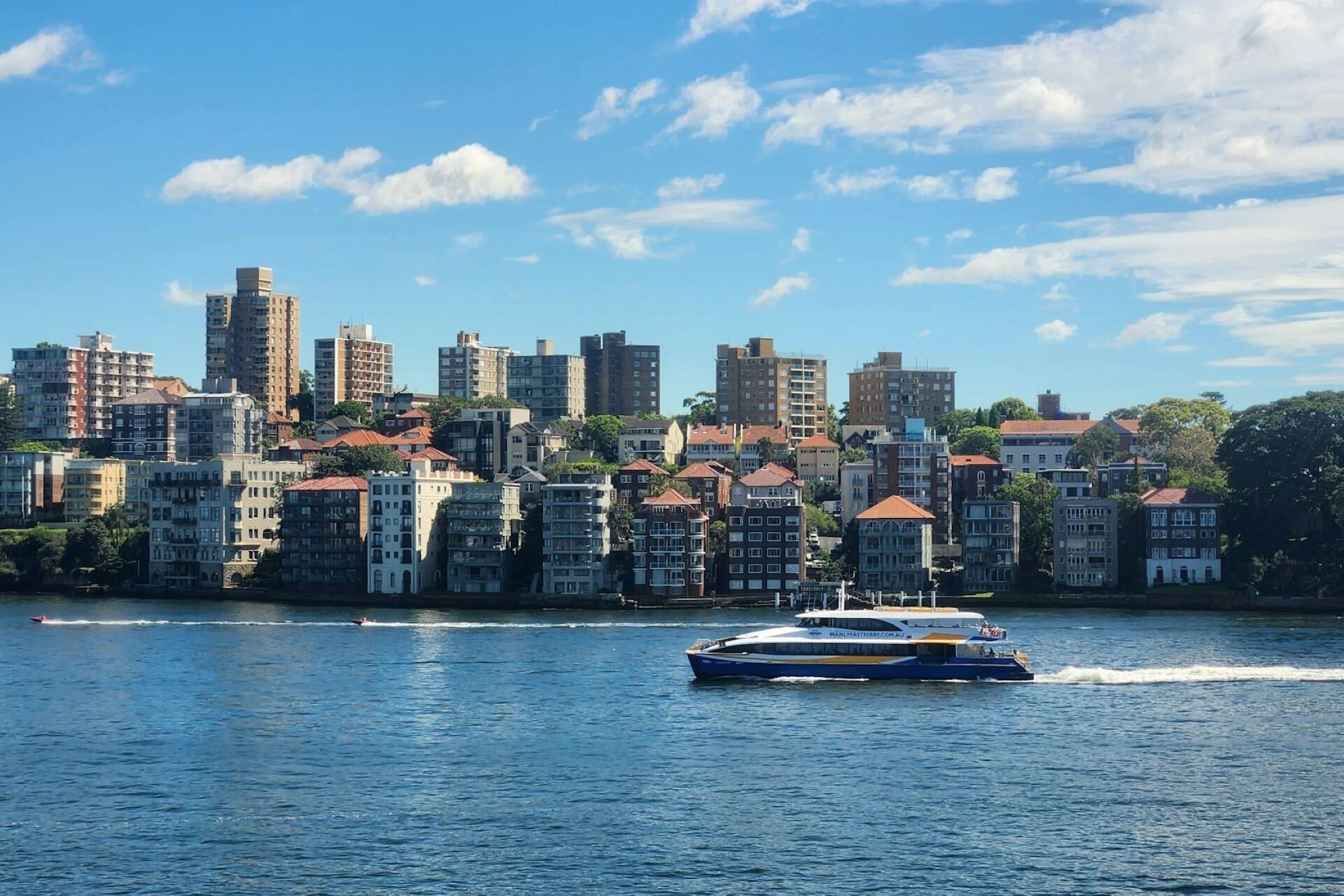 A boat and houses in Kirribilli, NSW.