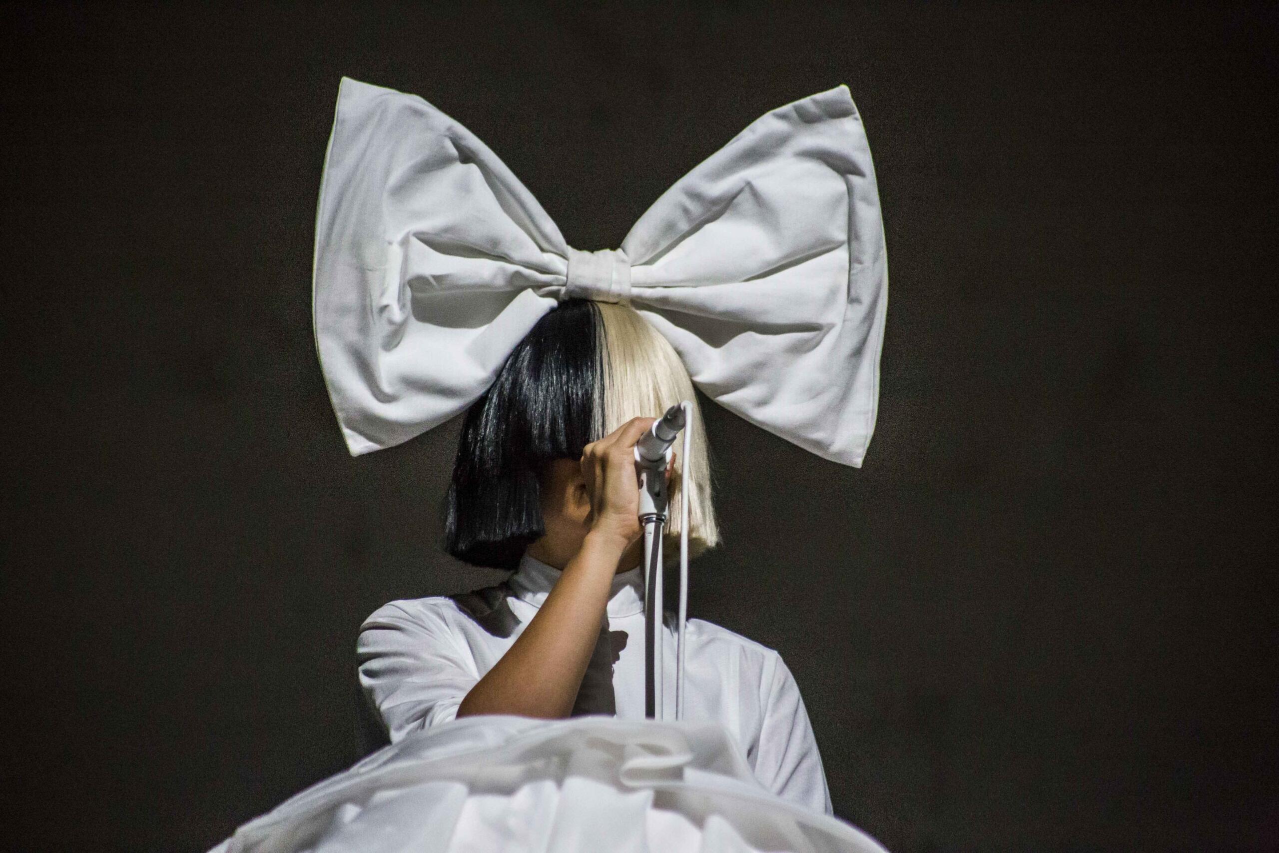 Sia performing on stage.