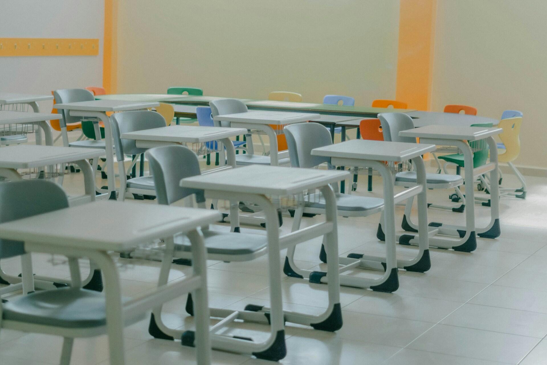 Empty desks and chairs at a school.