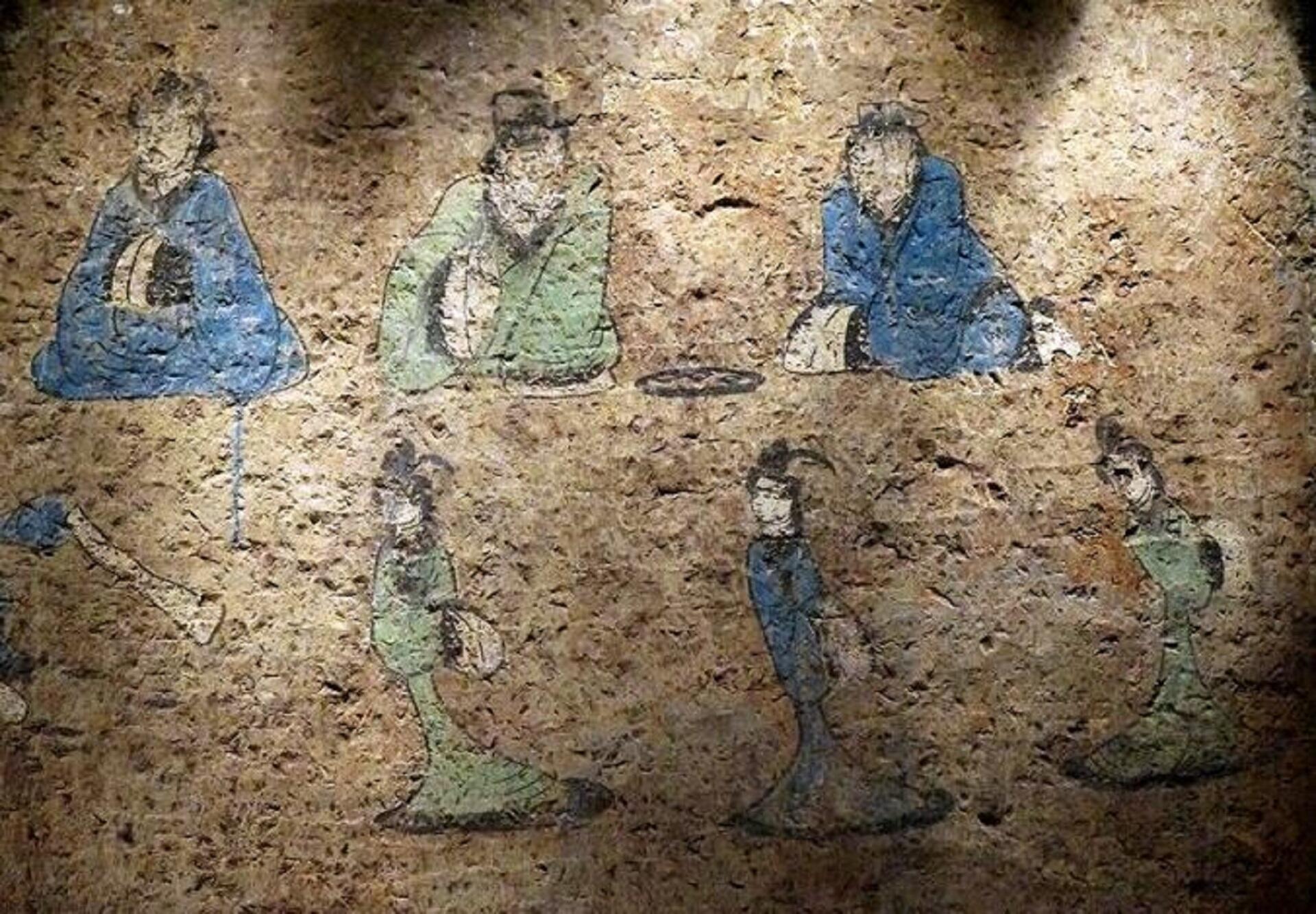 A wall painting of three men and three women wearing ancient Chinese clothing. 