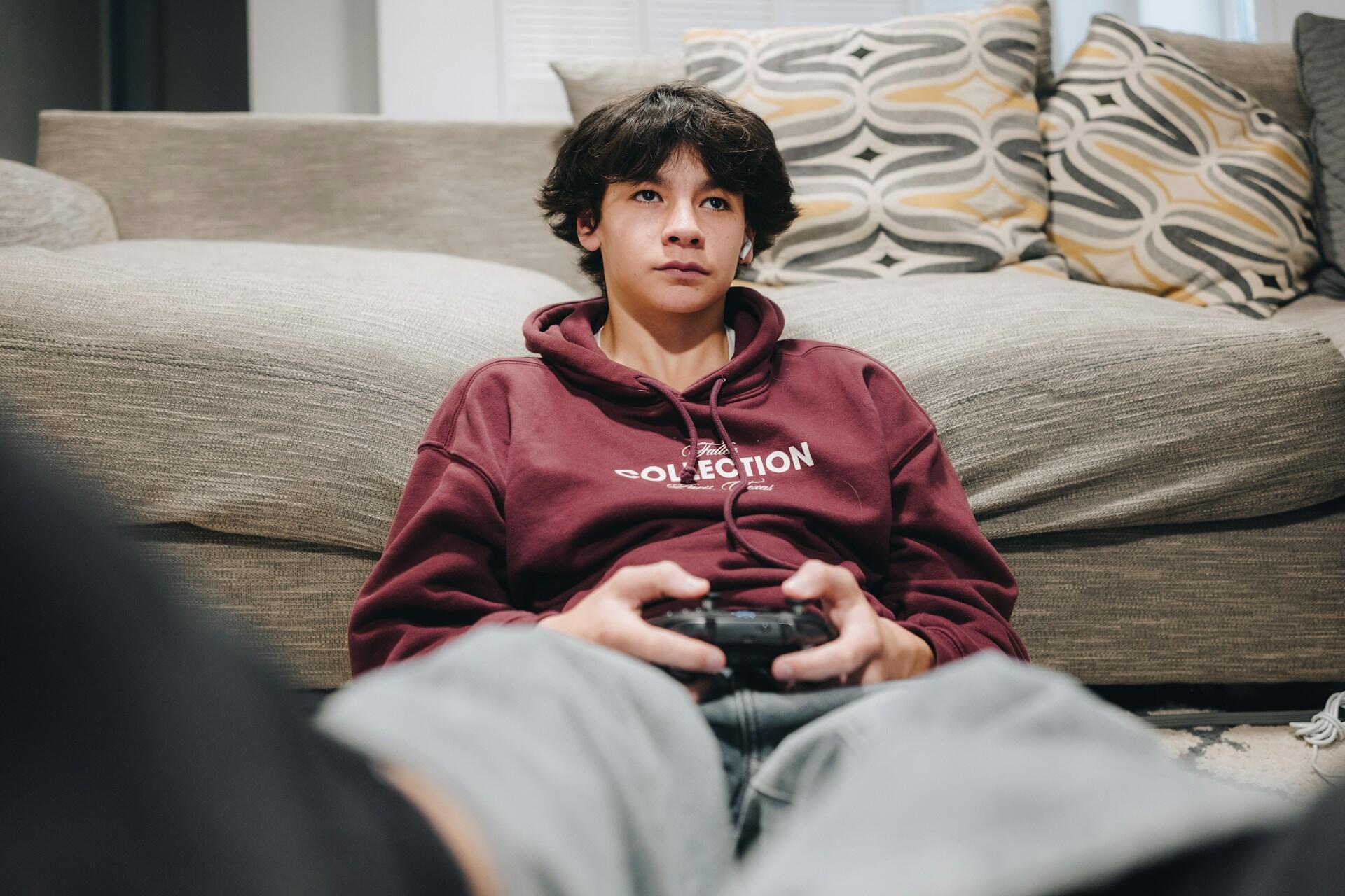 teen playing a video game