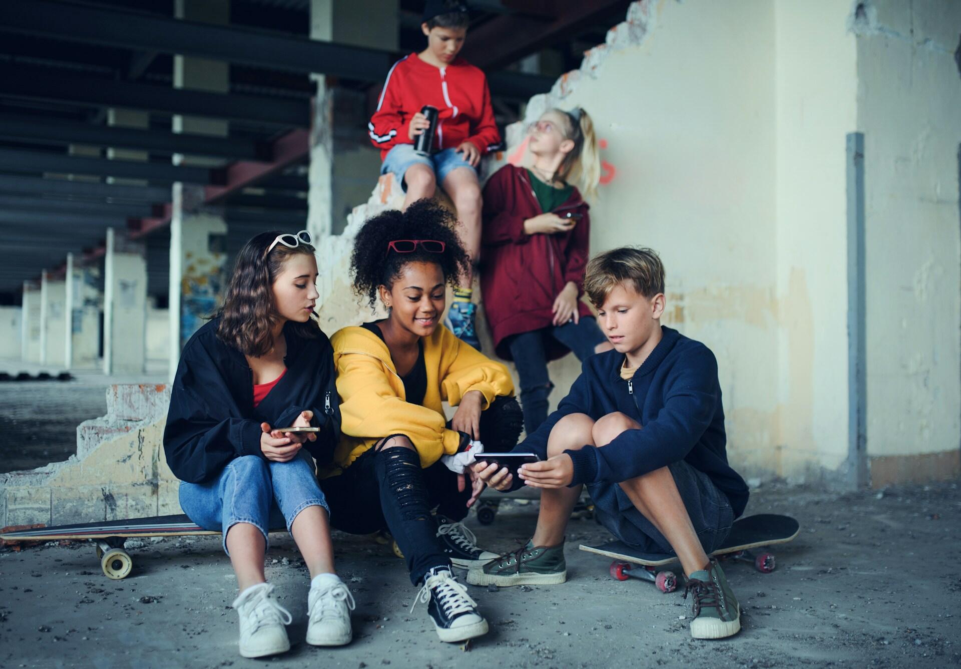 group of teens on their phones