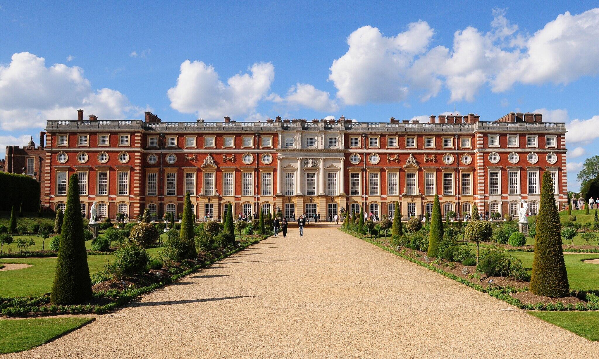 Hampton Court Palace, home of Henry VIII, surrounded by gardens and walking paths.