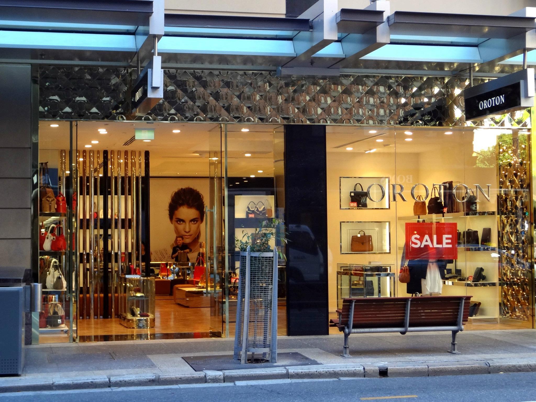 Oroton retail storefront with glass windows and handbag displays