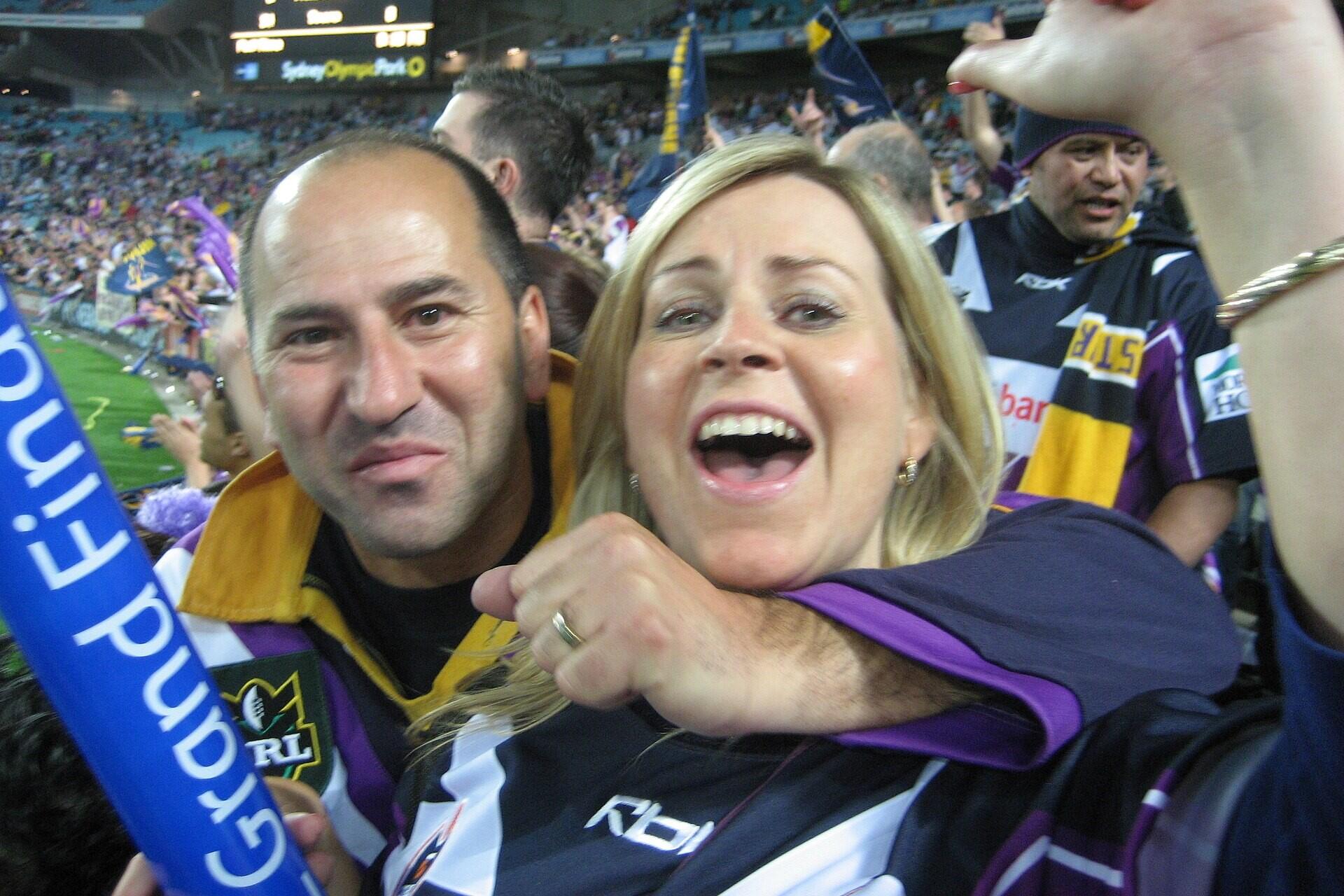 Melbourne Storm fans celebrating during an NRL finals match
