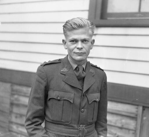 black and white photo of a young James McAuley in military uniform
