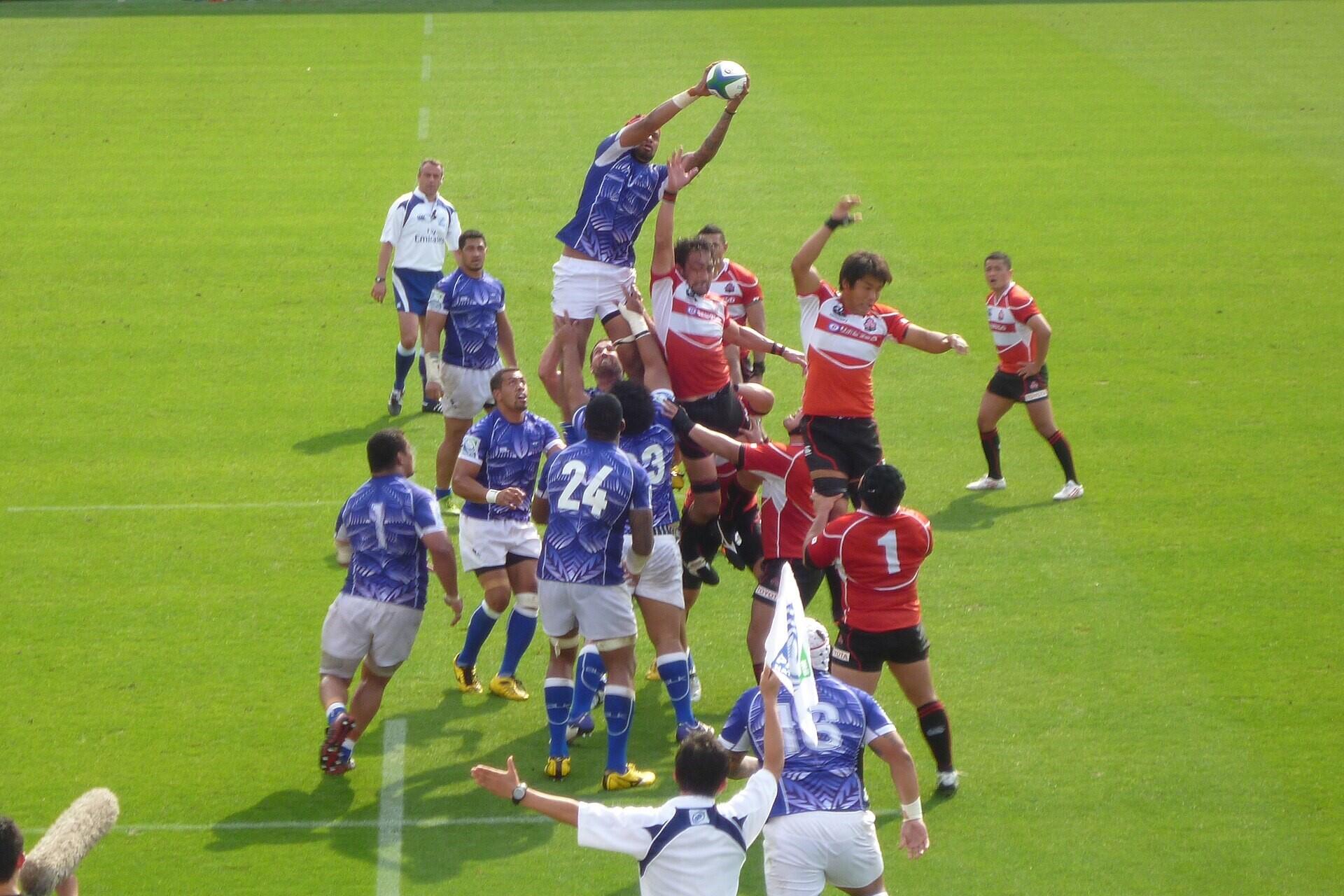 Rugby union players jumping to catch the ball during a lineout