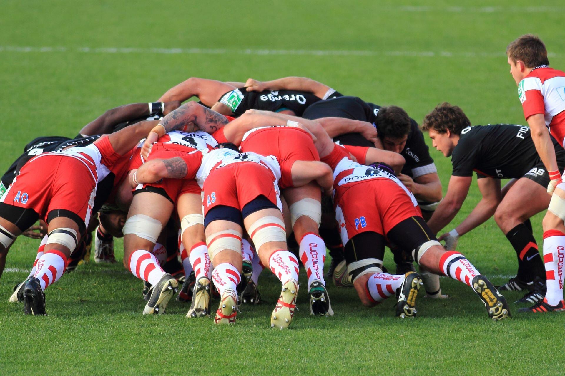 Rugby union forwards pushing together in a scrum during a match