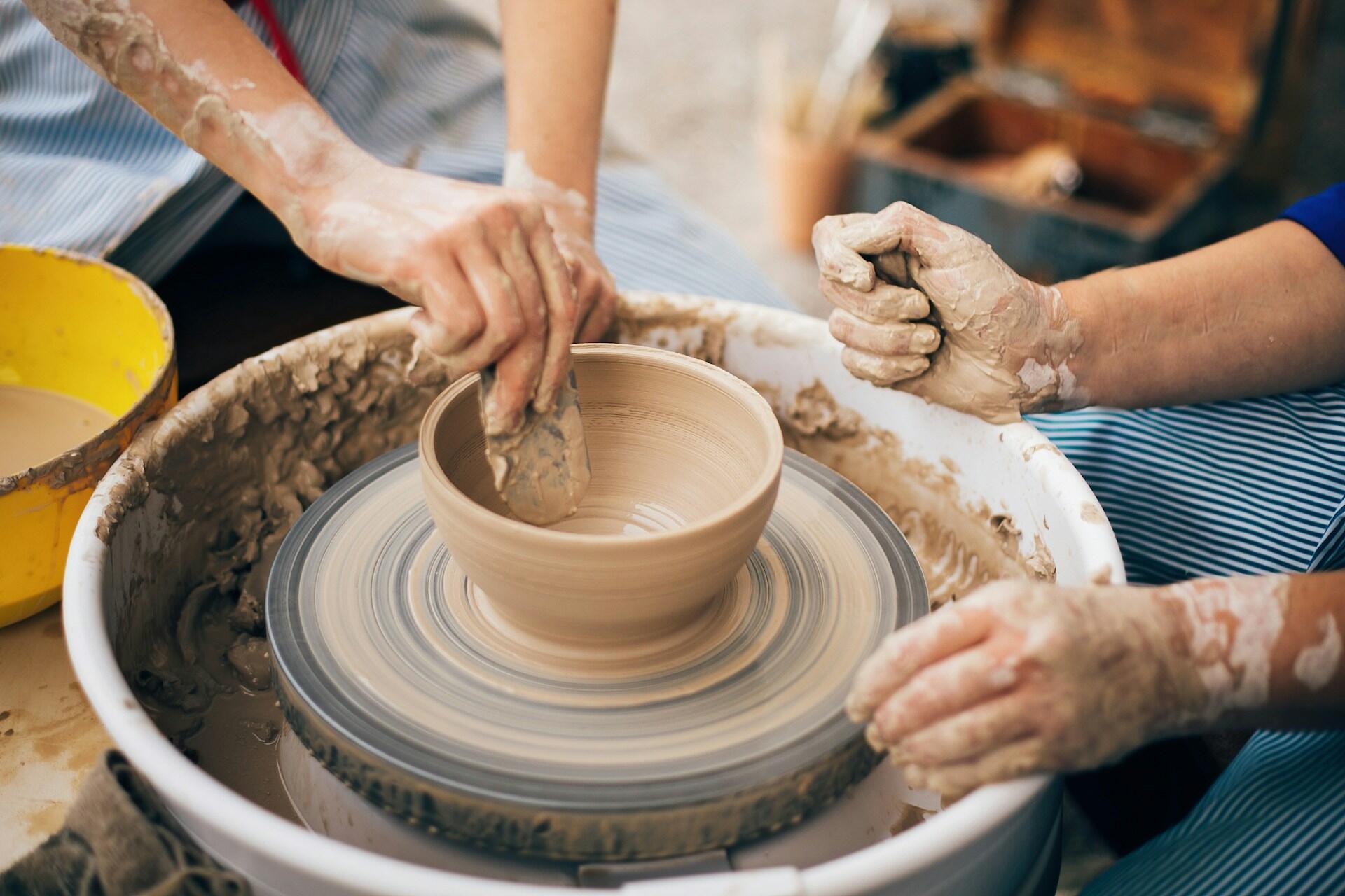 pottery making a bowl on a pottery wheel