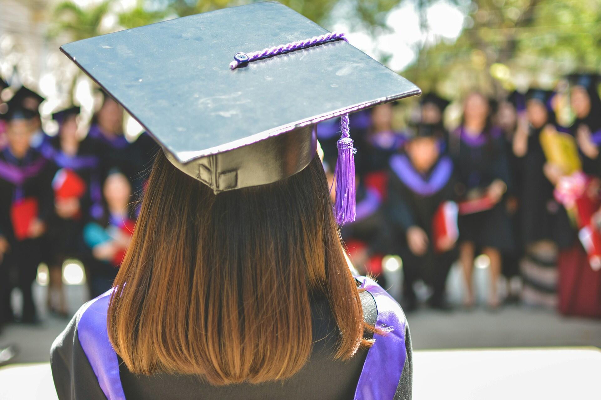 Graduate wearing a mortarboard at a graduation ceremony