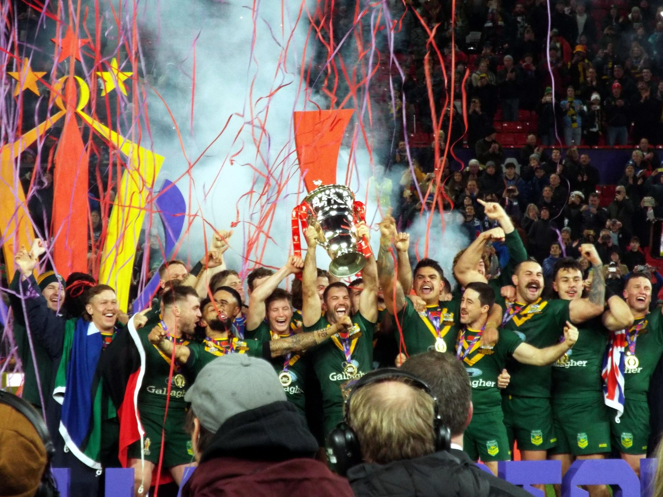 Australian national rugby league team lifts the Paul Barrière Trophy in 2021.