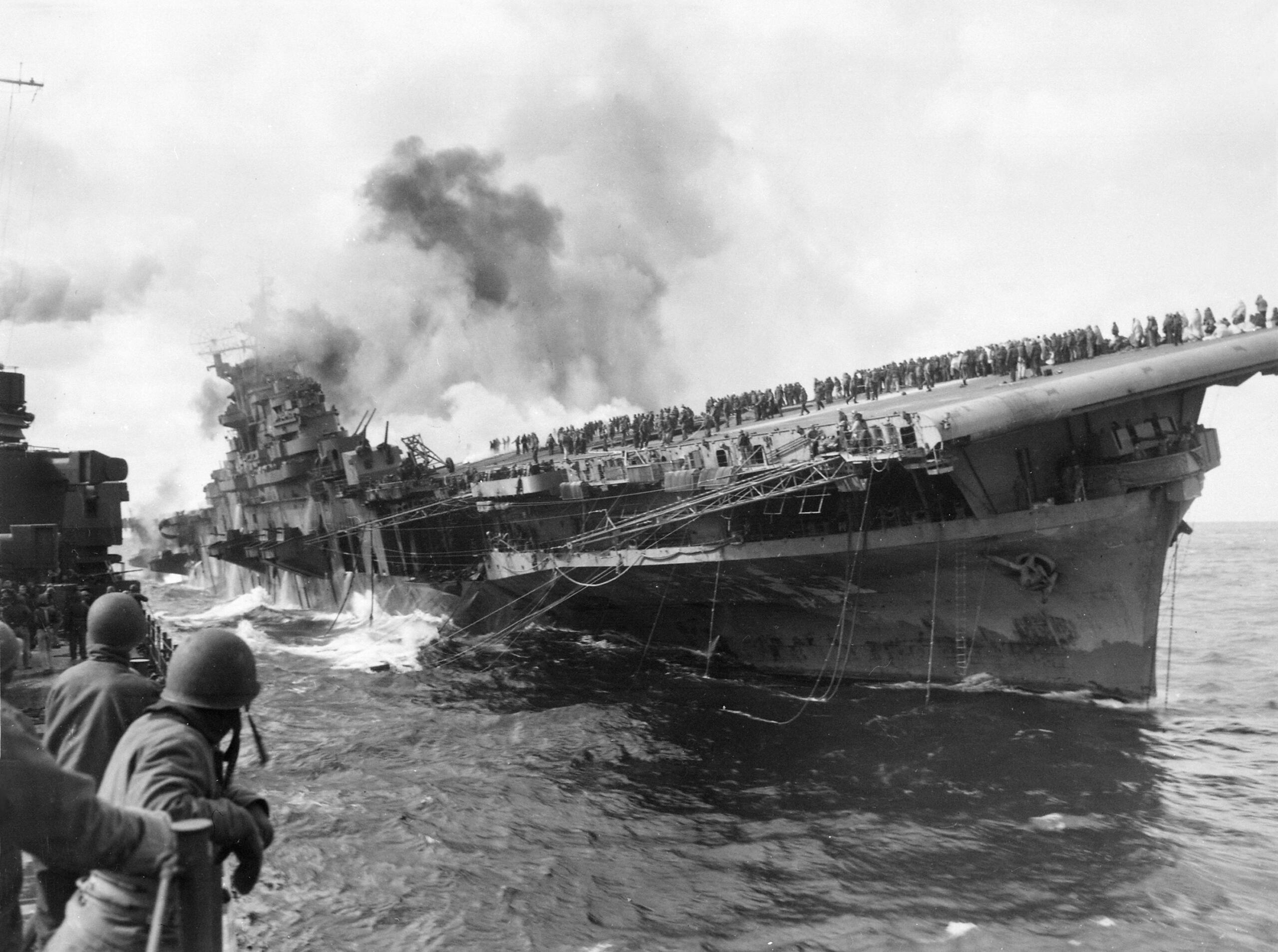 Black and white photo of the attack on carrier USS Franklin 19 March 1945