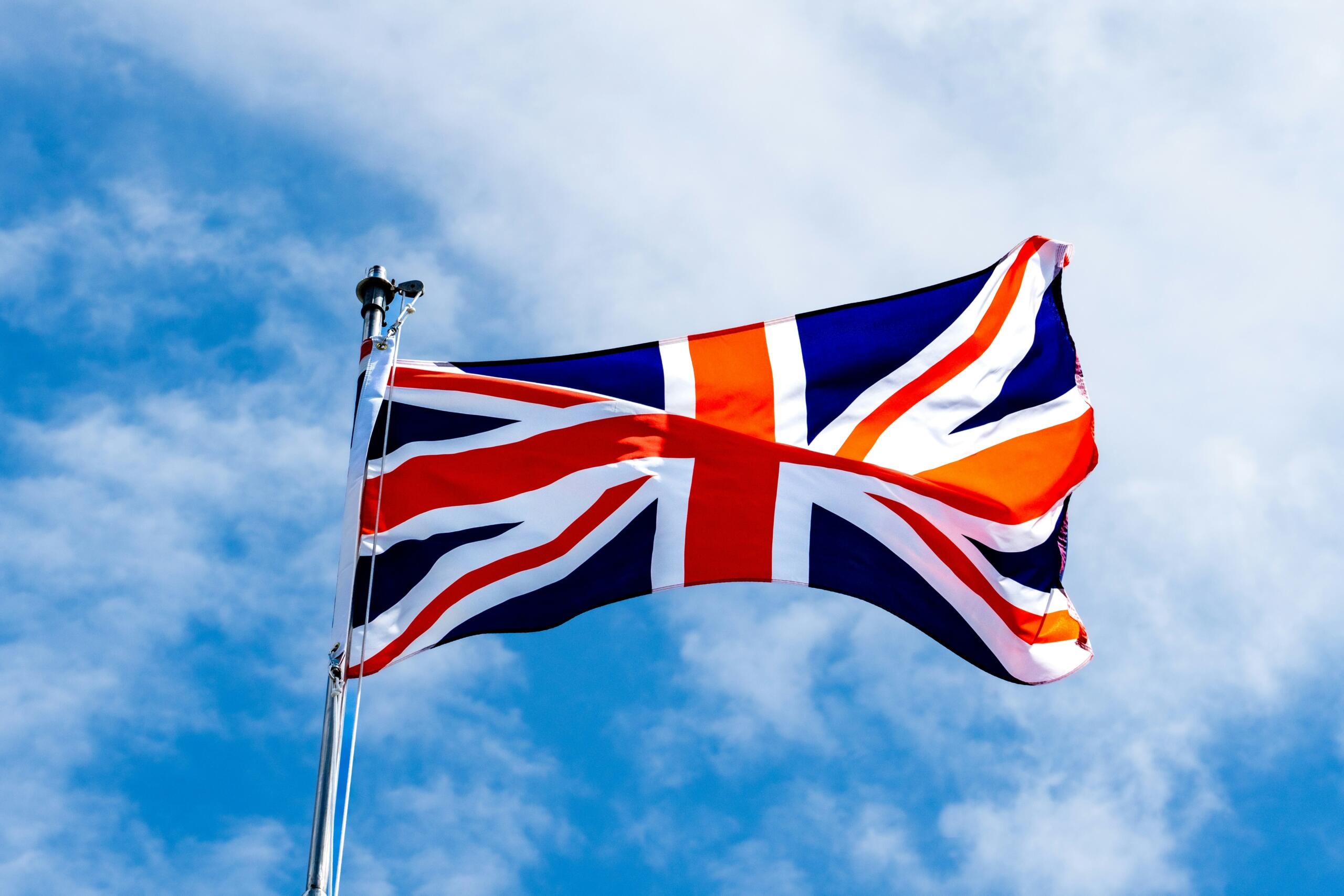 UK flag against a bright sky