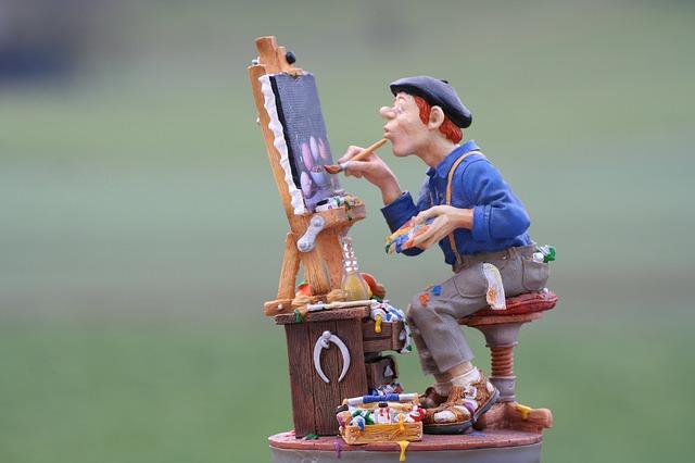 Pintor pinta tela em um cavalete.