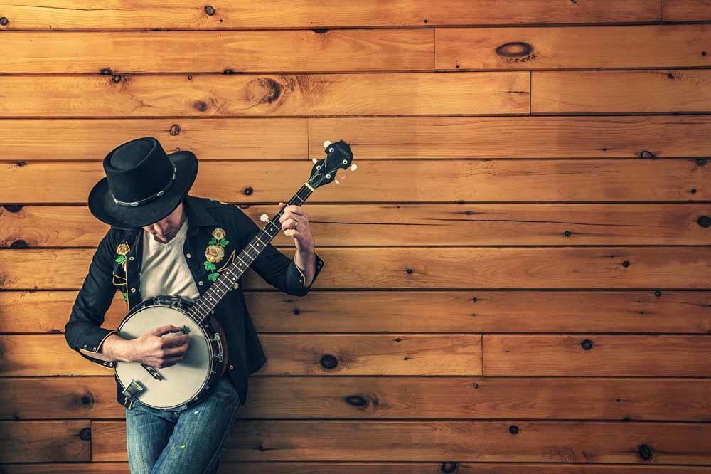 Faça aula de guitarra