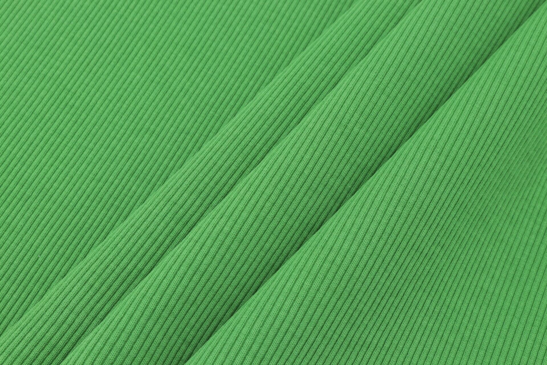 Imagem de um tecido verde canelado.