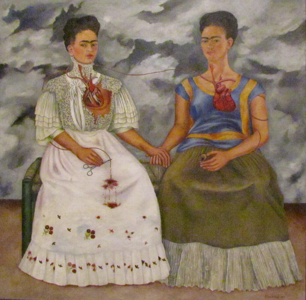 Surreal painting of two women sitting, holding hands with exposed hearts connected by a red thread under a cloudy sky.