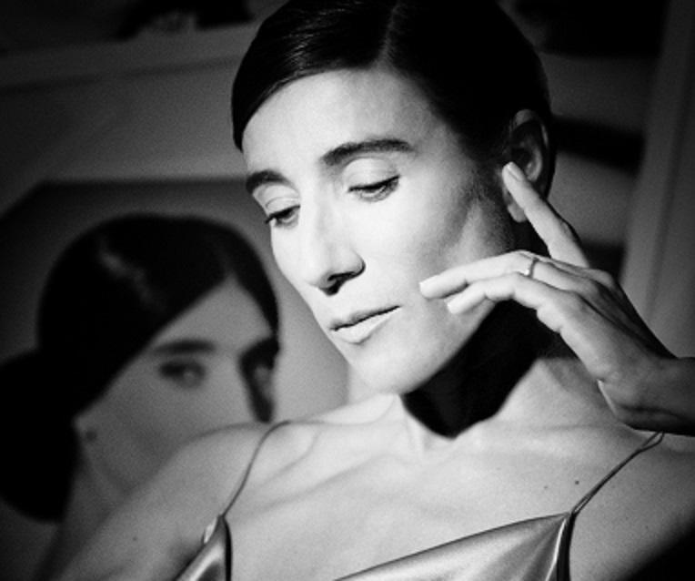Blanca Li in a reflective black-and-white portrait, highlighting her expressive dance persona.