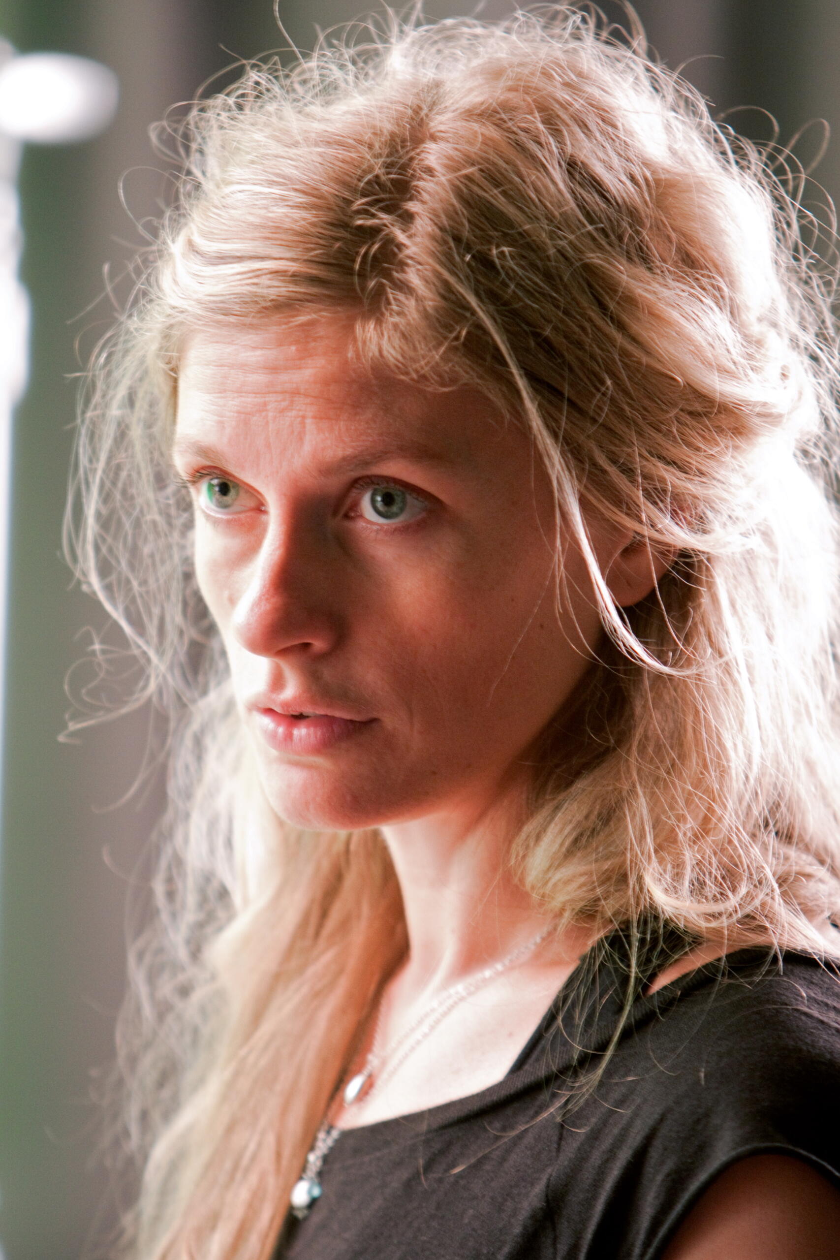 Crystal Pite in close-up, known for her powerful and emotionally charged choreography.