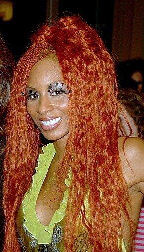 Mia Frye smiling at an event, best known for choreographing the Macarena.