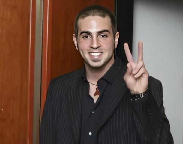 Wade Robson flashing a peace sign, choreographer behind major pop acts and TV dance shows.