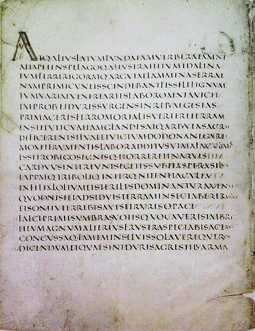 An ancient manuscript page featuring Latin text, written in a formal style with decorative capital letters at the start.