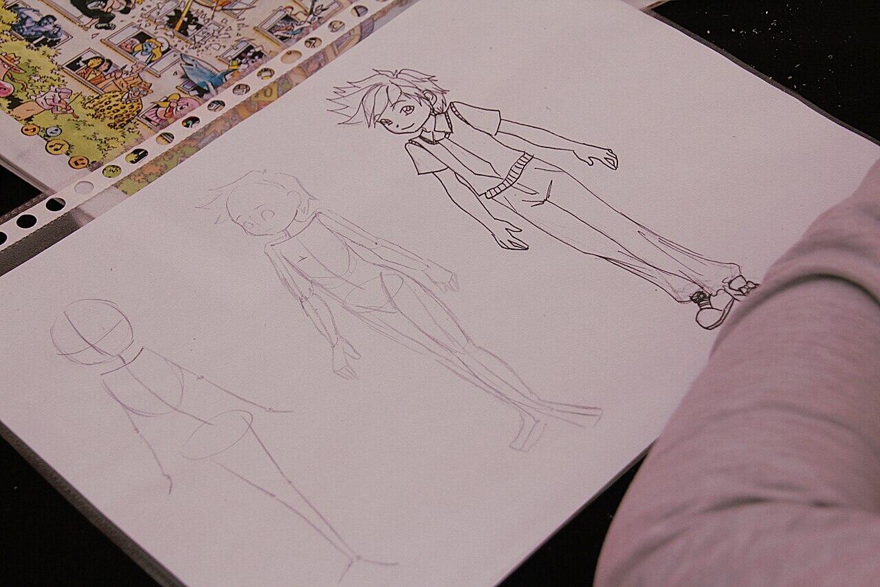 Sketchbook page showing anime-style character drawings, including a detailed standing figure and lighter construction sketches.