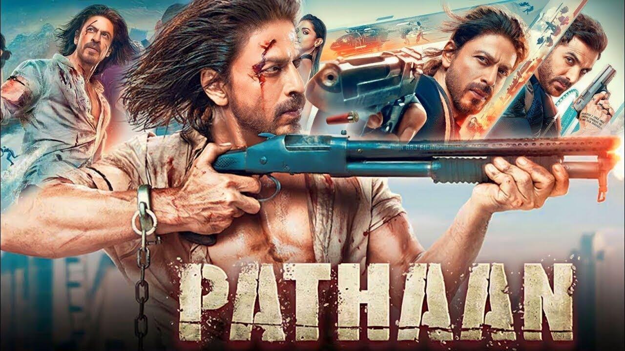 Action-packed poster of the Bollywood film Pathaan featuring Shah Rukh Khan holding a shotgun, with intense scenes and other characters in the background.