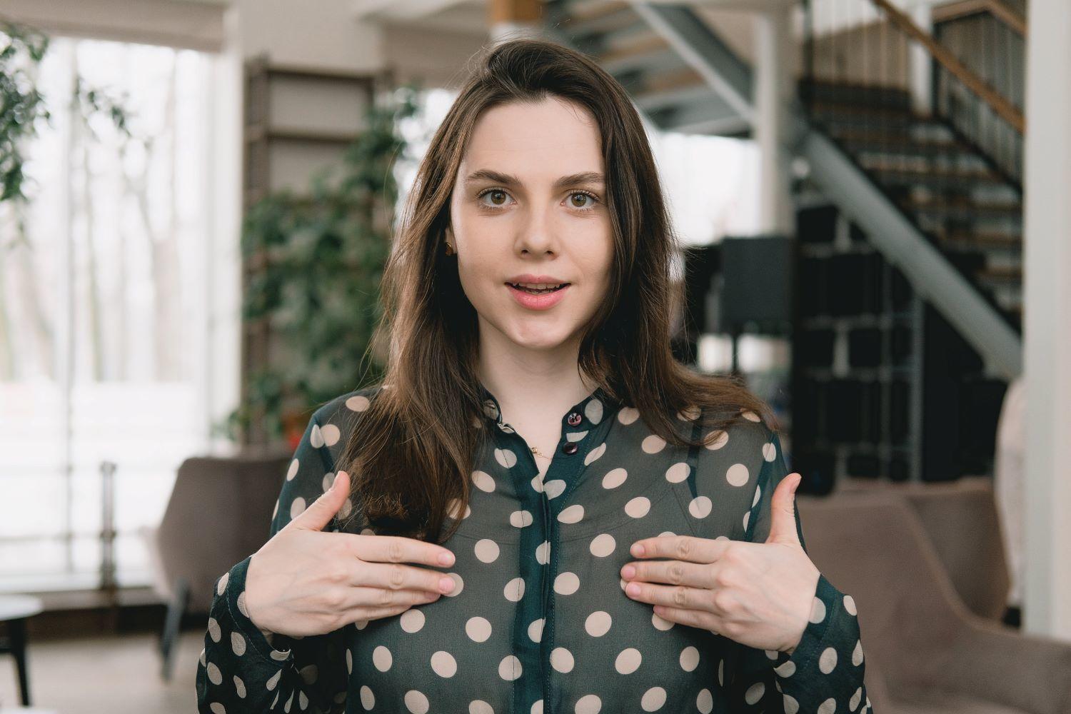 A young woman filming